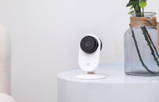 a YI Home Camera sitting on a table