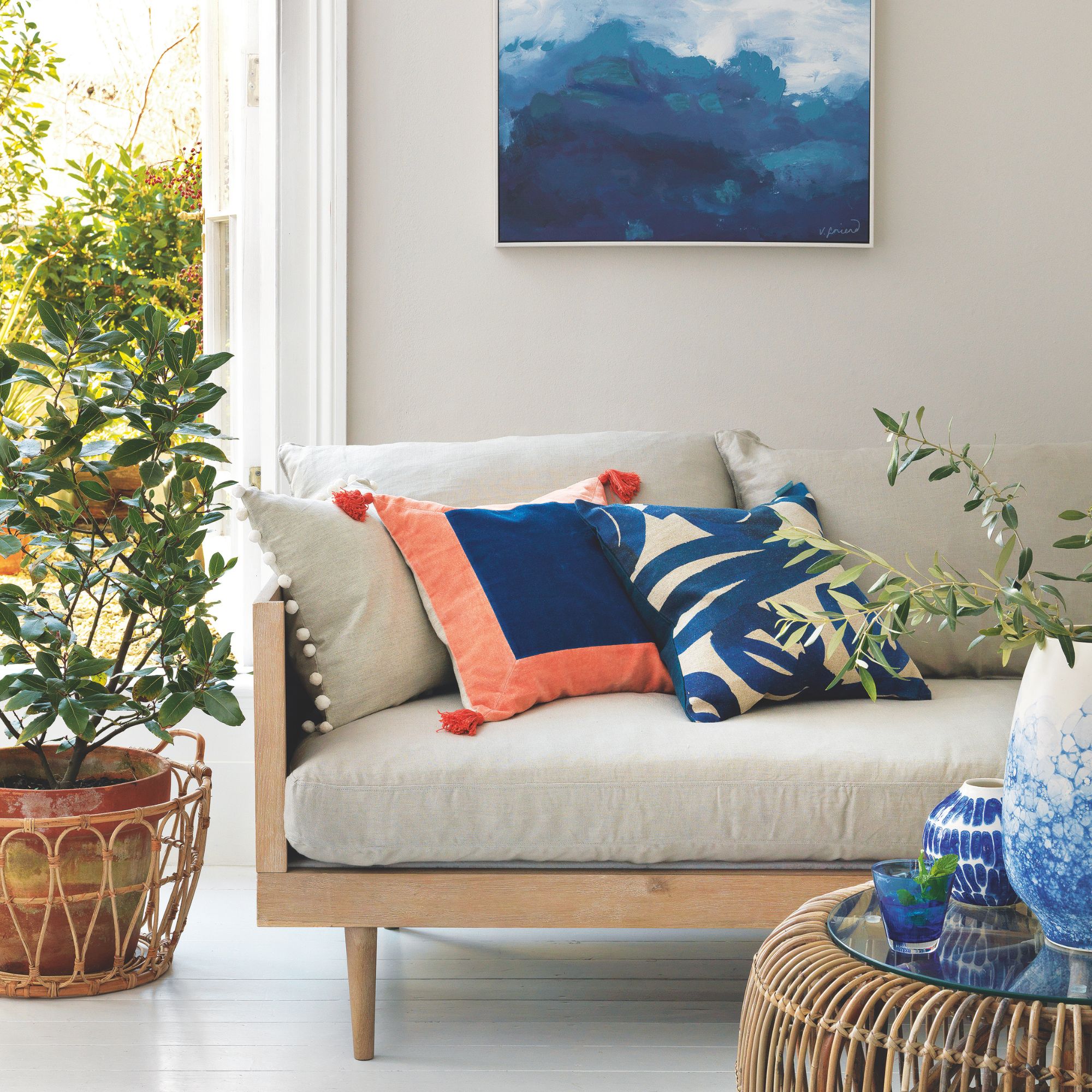 Neutral living room with blue accents and a coastal feel