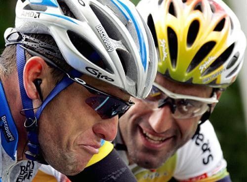 Lance Armstrong chats with Ivan Gutierrez during stage 2