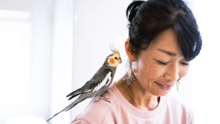 Woman and pet bird