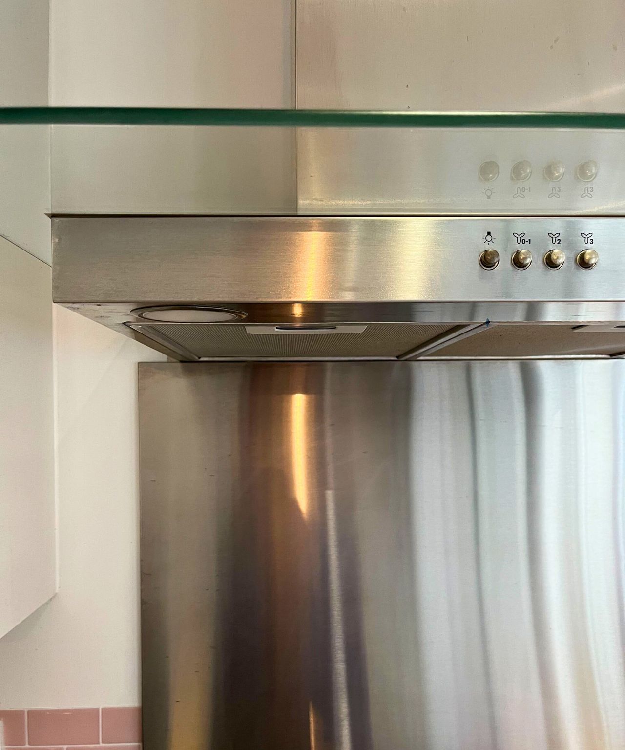 My grime and streak free stainless steel extractor hood. The glass above it is also spotless