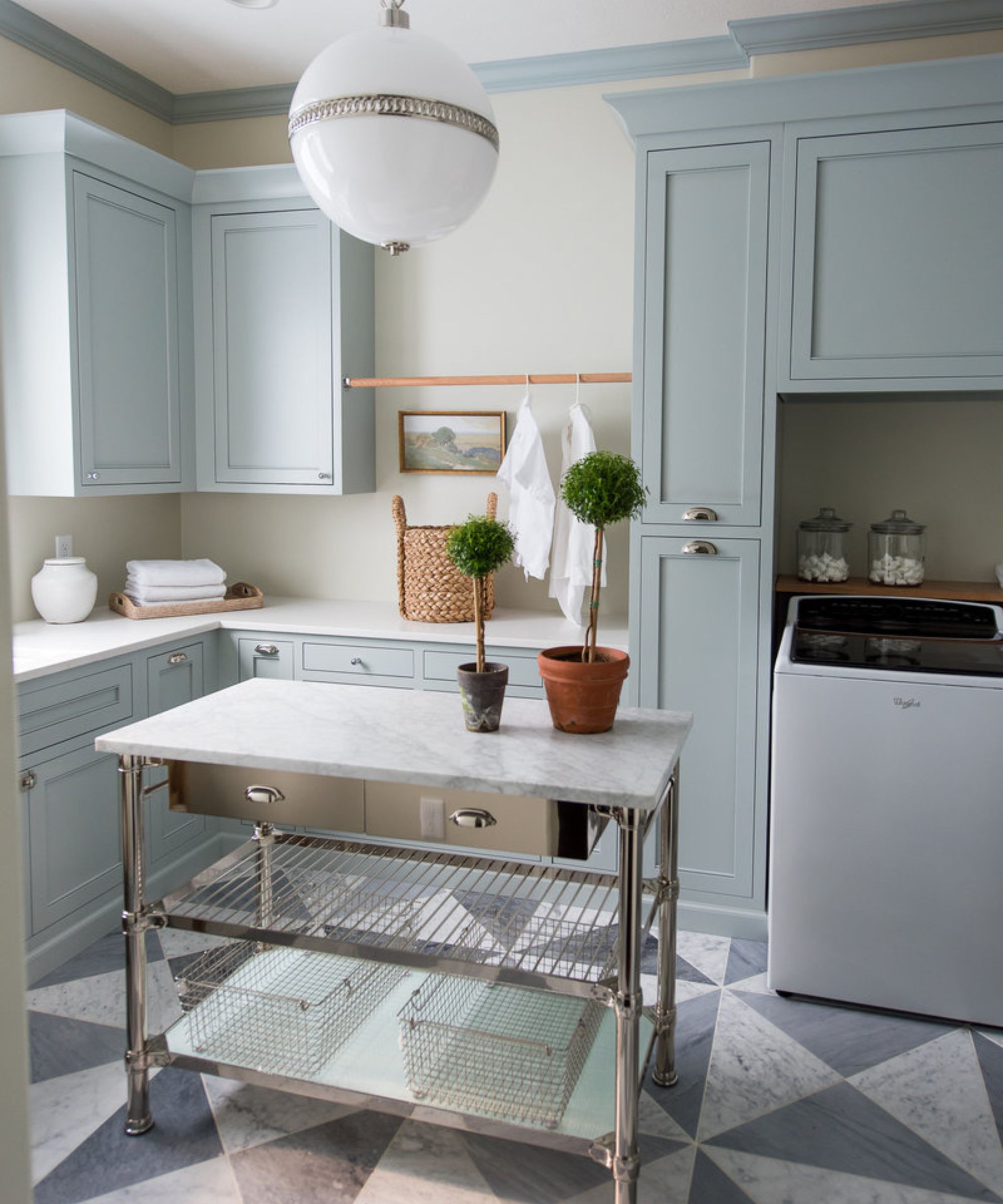 laundry room with a metal island unit