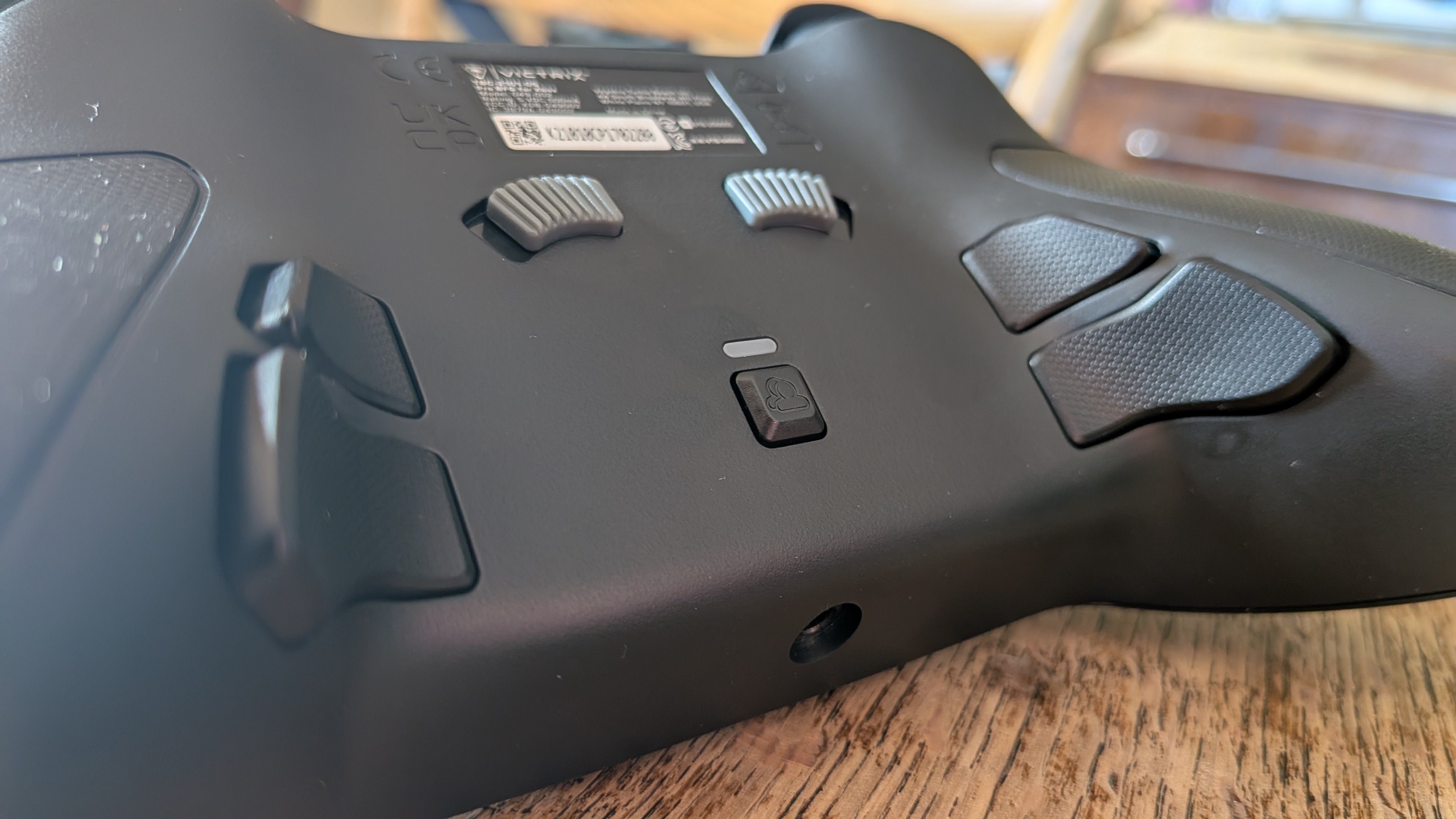 The rear of the Victrix Pro BFG Reloaded, showing its paddle buttons and trigger stop switches