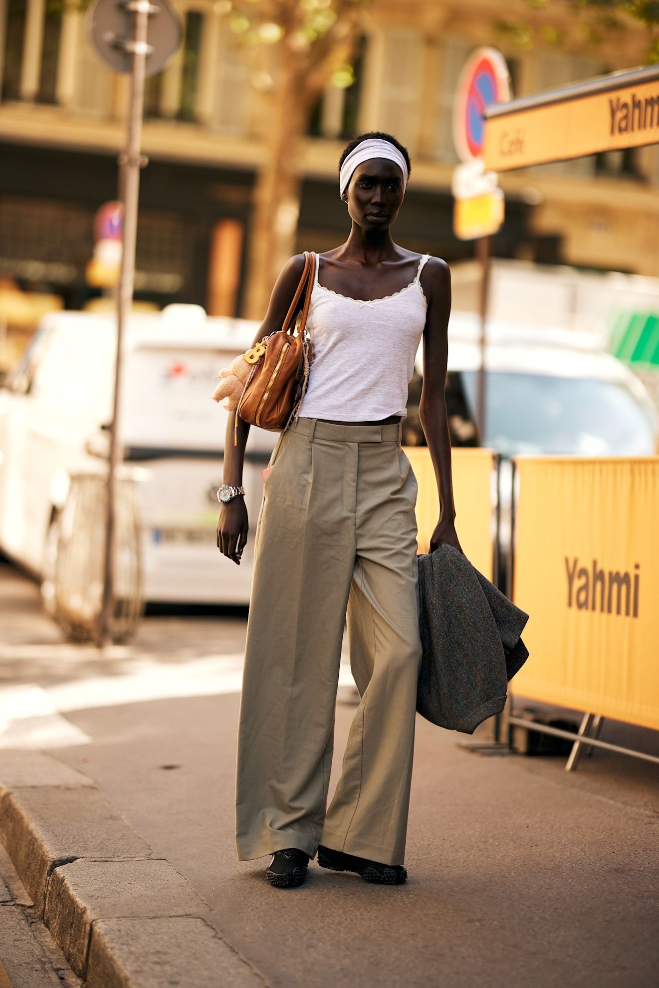 fashion week attendee wearing white tank top and trousers