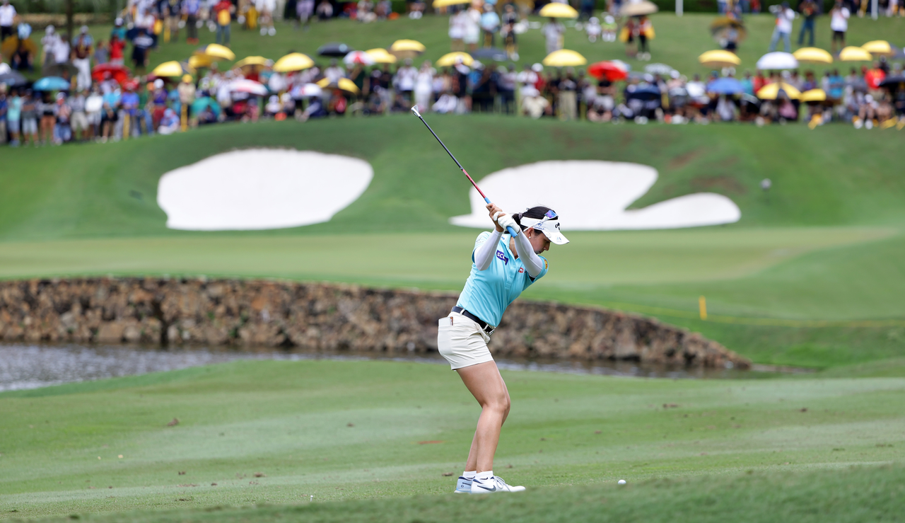 Jeeno Thitikul strikes an iron into the middle of the green