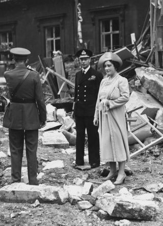 Queen Elizabeth and George VI visit the aftermath of a Blitz bombing