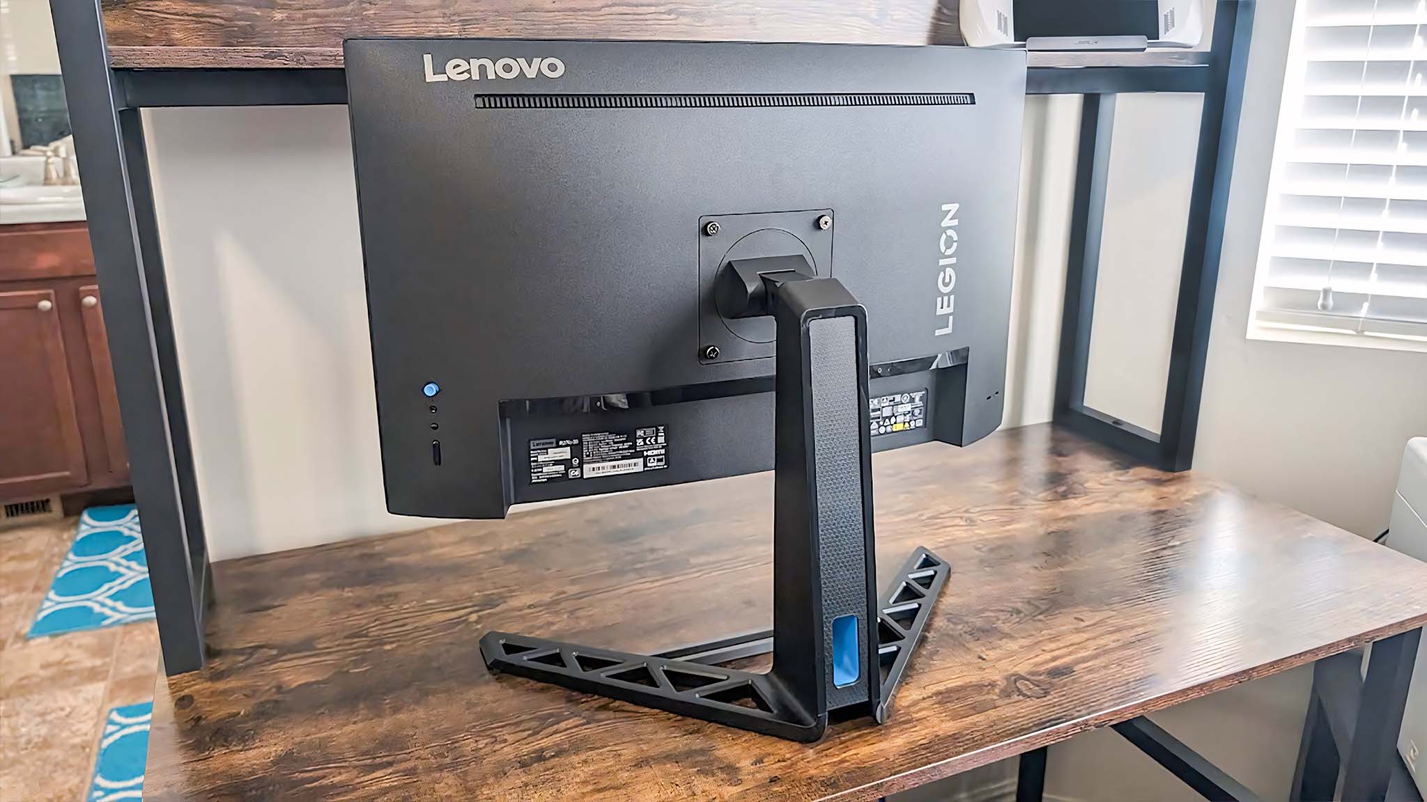 Backside of Lenovo Legion R27fc-30 as it stands on a desk.