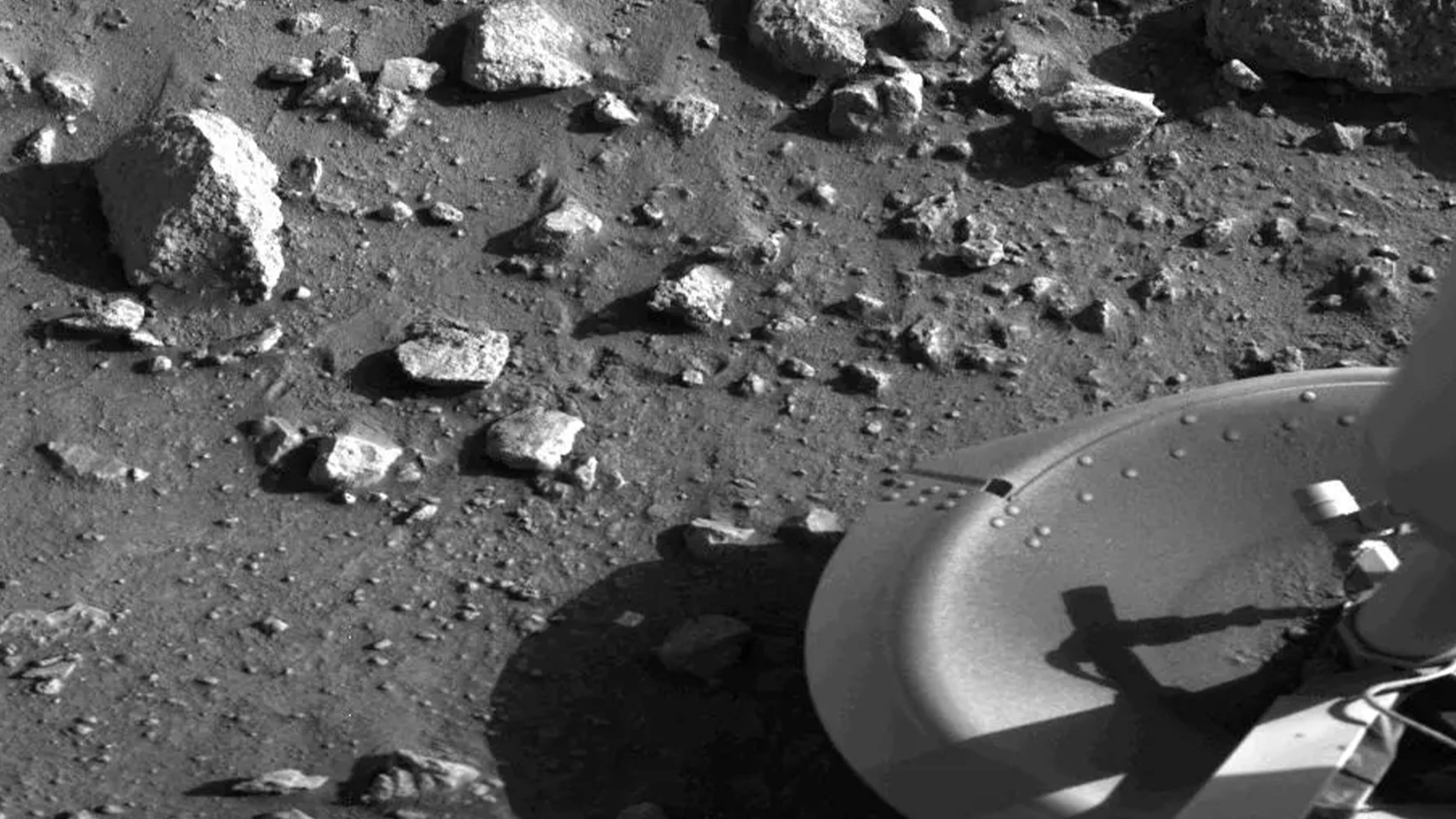 Spacecraft foot on rocky surface. 