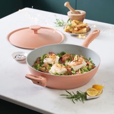 Dusty pink pan on top of counter displaying cooked food
