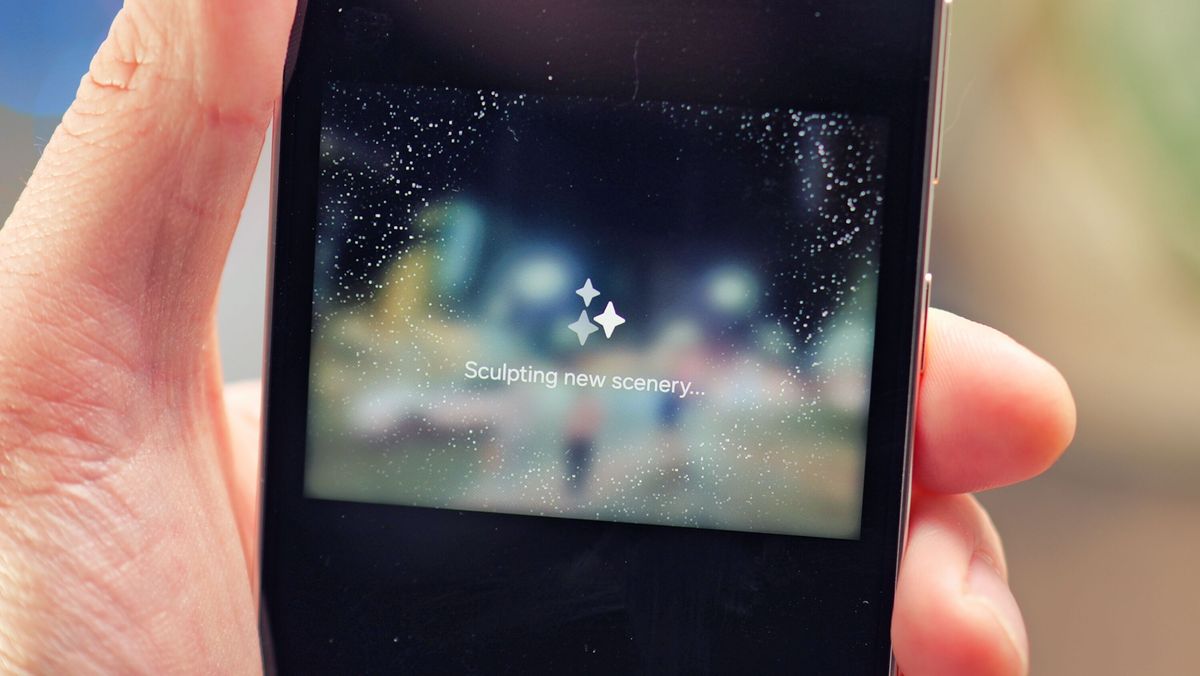 Samsung Galaxy S24 phone held in a hand with the screen showing photo editing software