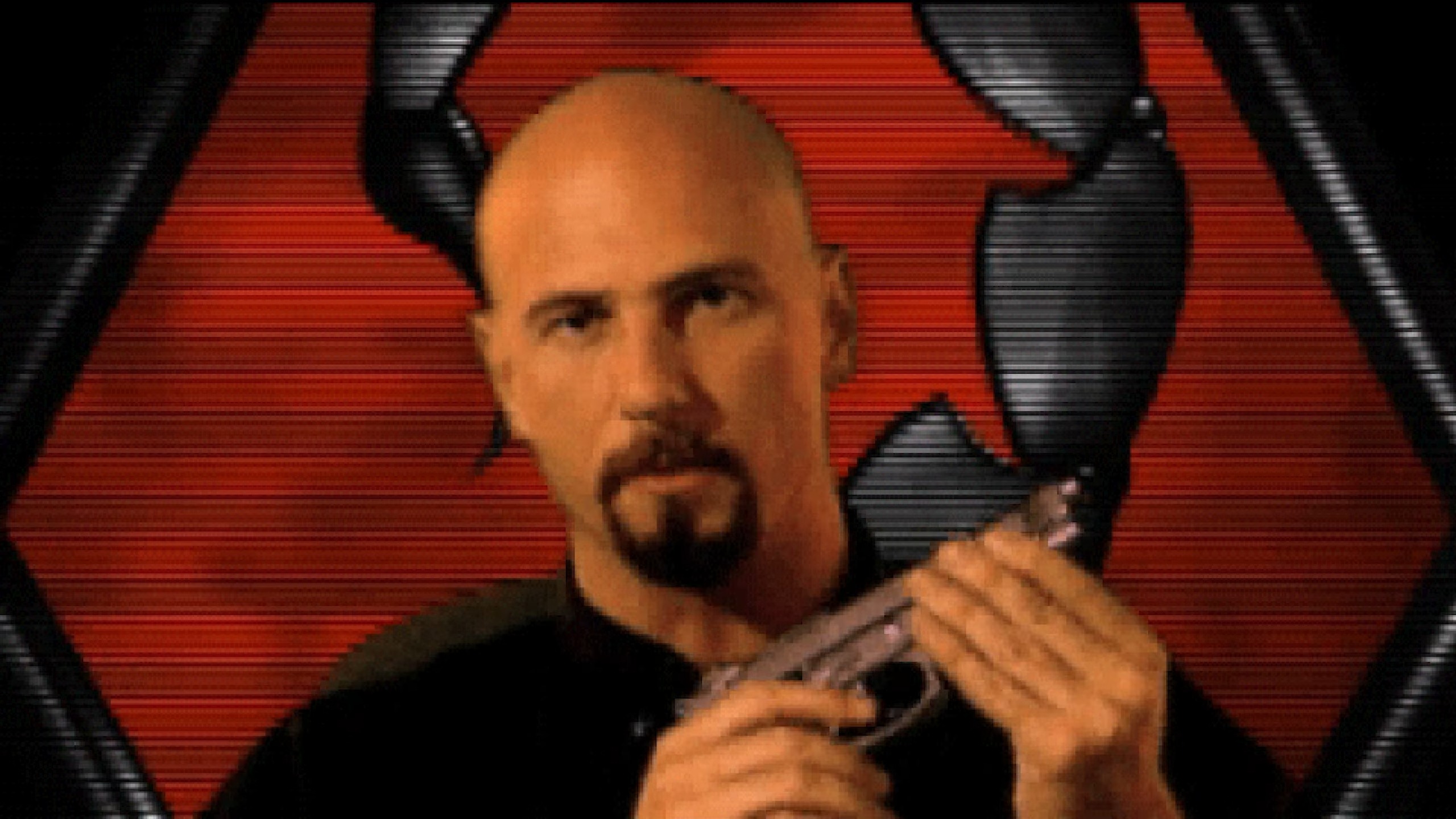Joe Kucan as Kane fondles a pistol.