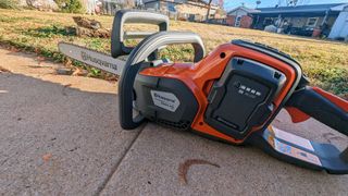 Husqvarna Power Axe 350i Cordless Electric Chainsaw being tested in writer's home