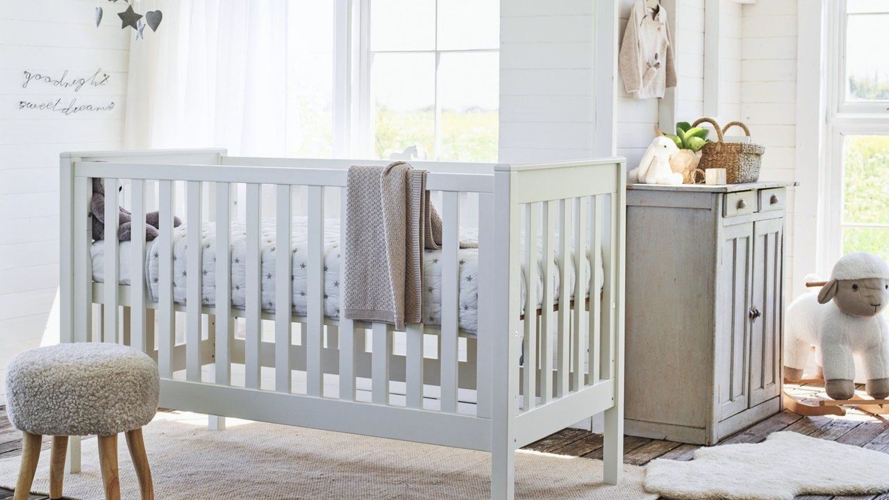 Nursery ideasWhite nursery with wooden cot