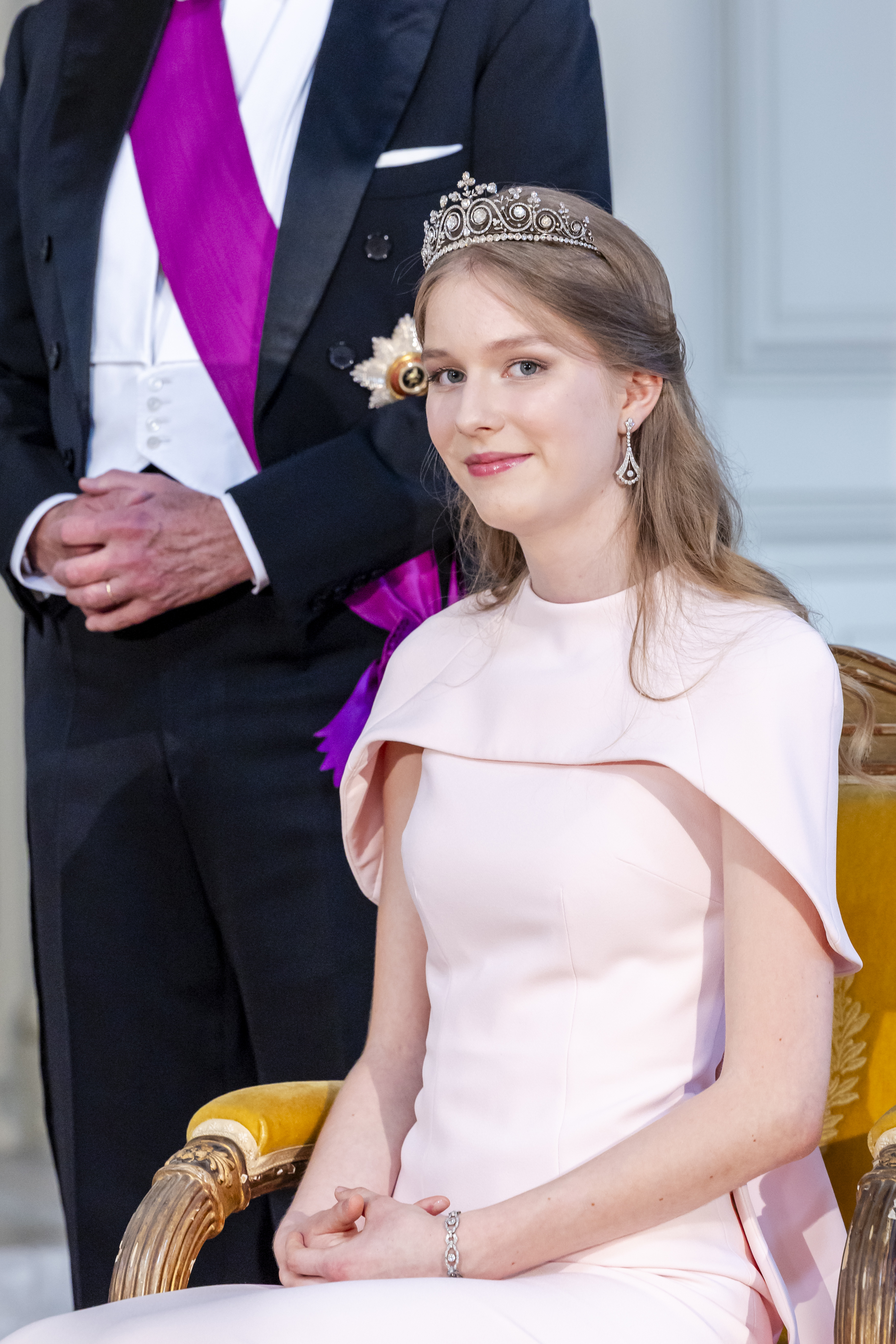 Princess Eleonore in a pink caped gown and tiara