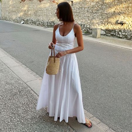 Woman in a white poplin dress