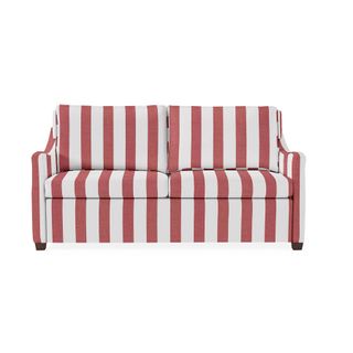 A striped sofa in red and white candy stripes