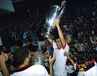 Dejan Savicevic celebrates with the Champions League trophy after AC Milan's win over Barcelona in the 1994 final.