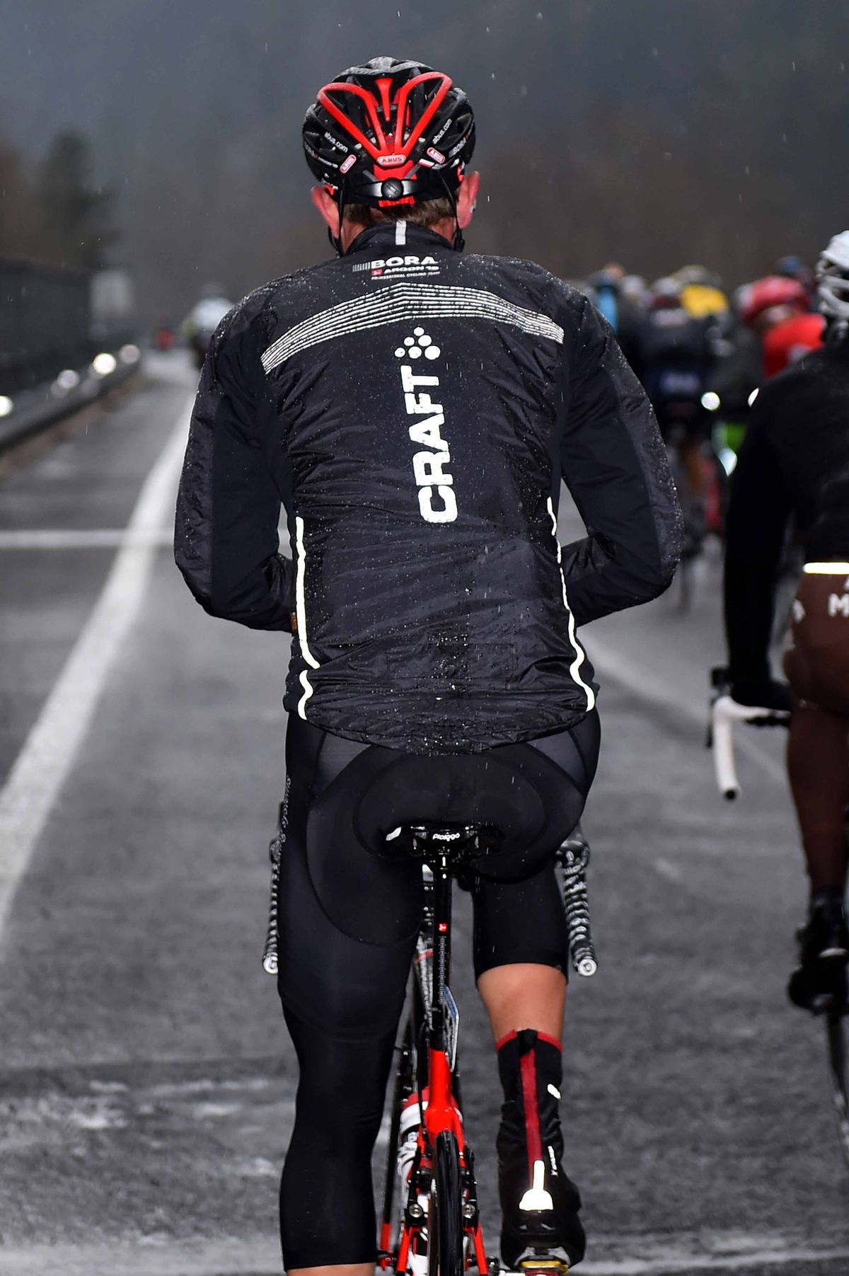 A Bora-Argon 18 rider in full rain gear