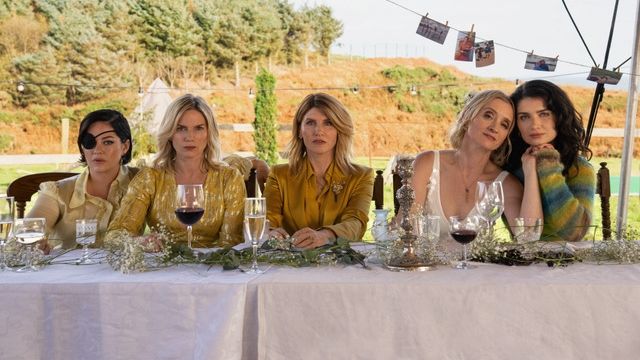 The Garvey sisters sitting together at a wedding table in Bad Sisters season two.