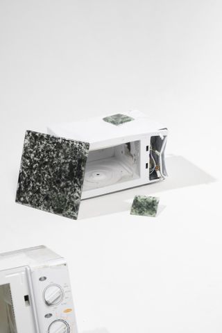 Recycled glass tiles and discarded microwaves