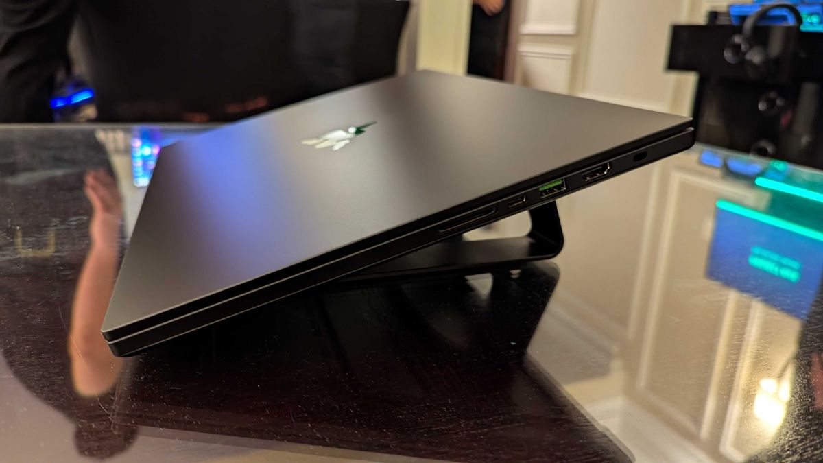 The Razer Blade 16 (2025) on a table with the lid closed.
