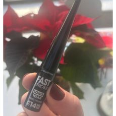 An image of Matilda Stanley holding the Collection Fast Stroke Long Wear Eyeliner