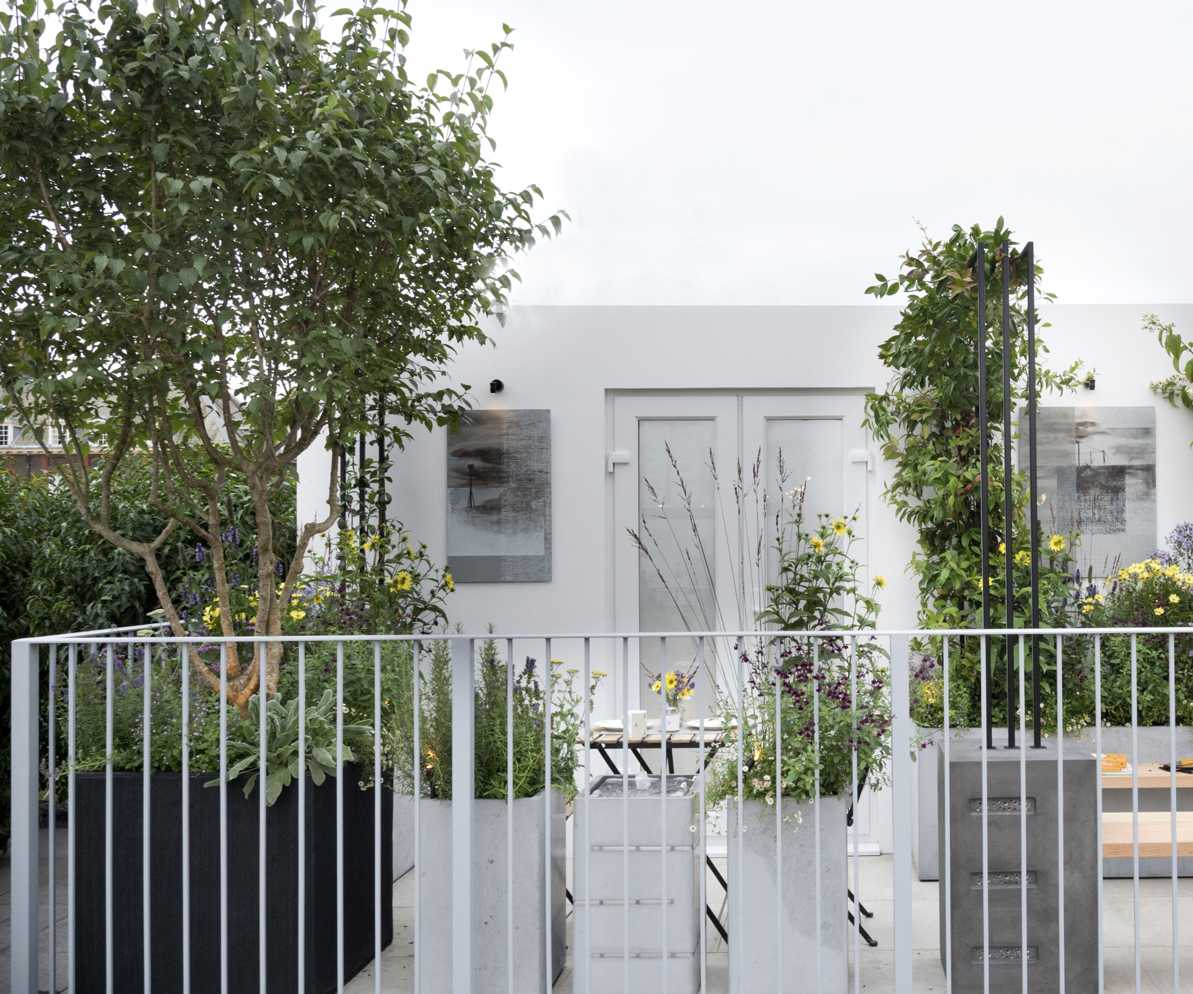 balcony garden with trees in planters