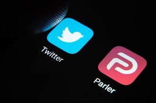 Parler and Twitter app logos on a screen