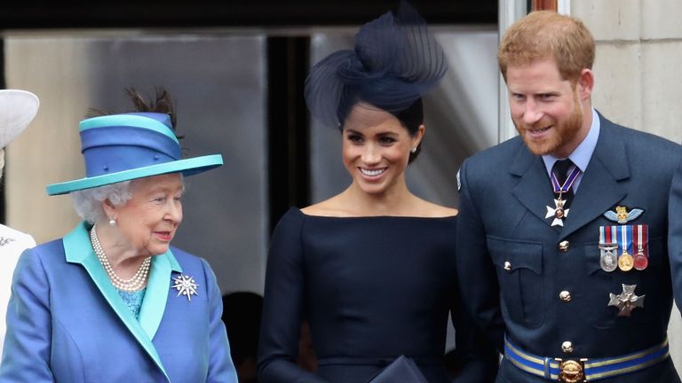 london, england july 10 l r queen elizabeth ii, meghan, duchess of sussex, prince harry, duke of sussex watch the raf flypast on the balcony of buckingham palace, as members of the royal family attend events to mark the centenary of the raf on july 10, 2018 in london, england photo by chris jacksongetty images