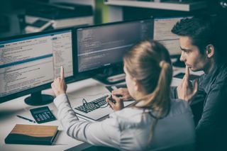 Woman and mand looking at a computer screen