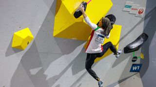 Elnaz Rekabi competes during the women's boulder semi-finals of the IFSC Climbing World Championships in Bern, Switzerland