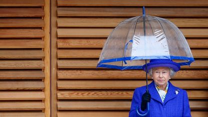the Queen insisted on always holding her own umbrella because of this particularly sensible reason