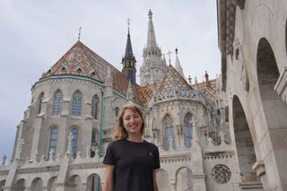 Image shows Anna in front of Matthias Church in Budapest