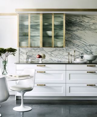 white kitchen with marble backsplash