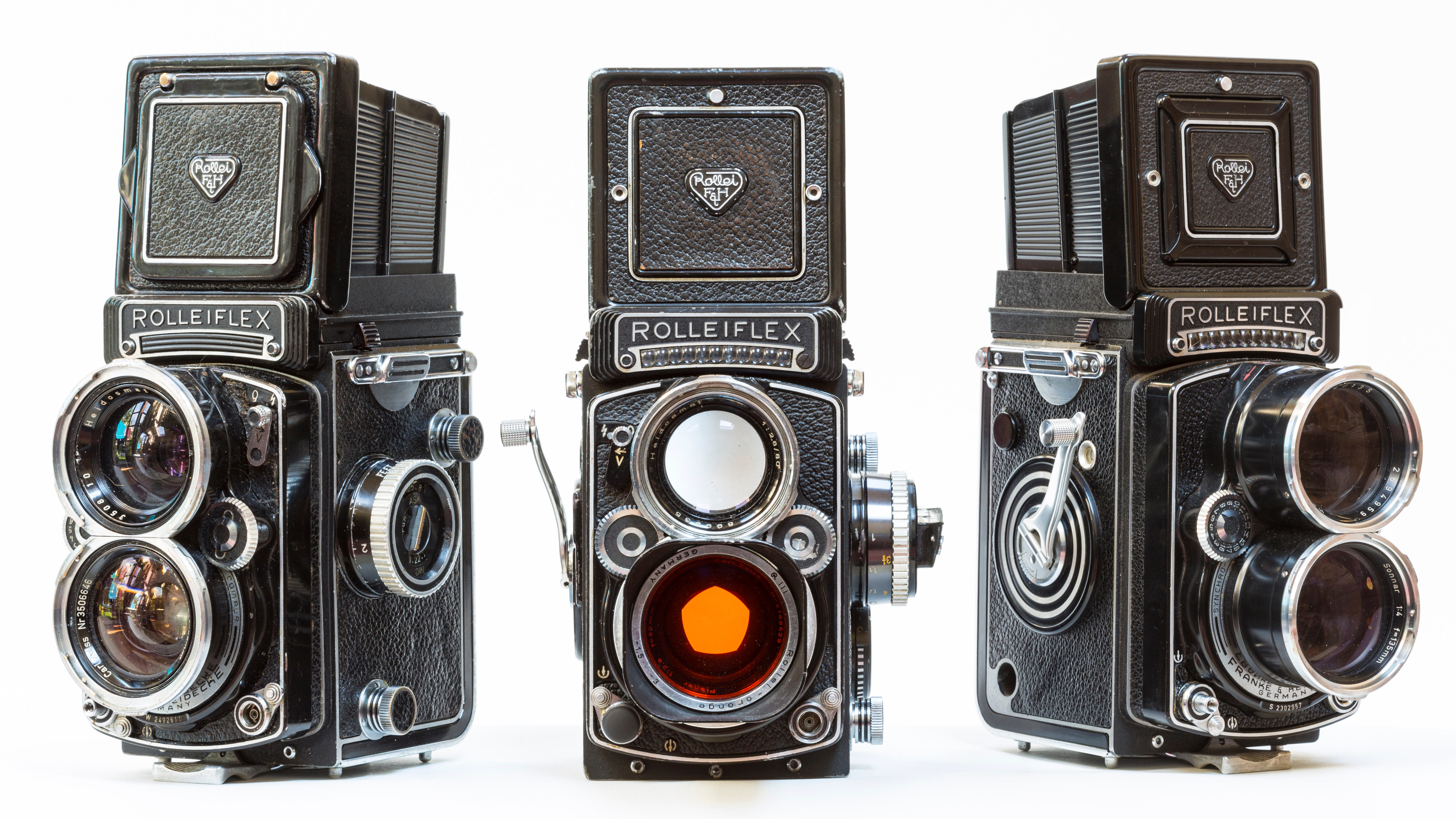 A trio of 1960s Rolleiflex professonal photographers film cameras used in the 1960's: Rollei Wide-angle, RolleiTLR 2.8F and a Tele Rollei.