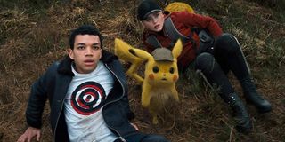 Detective Pikachu Tim Pikachu and Lucy look up at the incoming threat