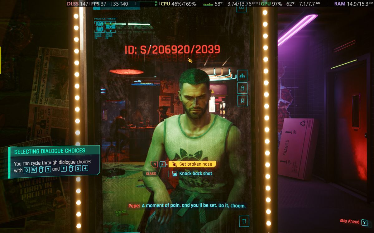 Cyberpunk 2077 gameplay screenshot showing the male protagonist and UI elements running on an Alienware 15 laptop