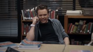 Joel McHale on the phone on Community