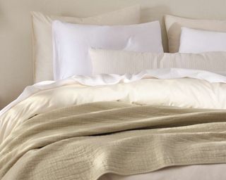 White and beige linen bedding and pillows