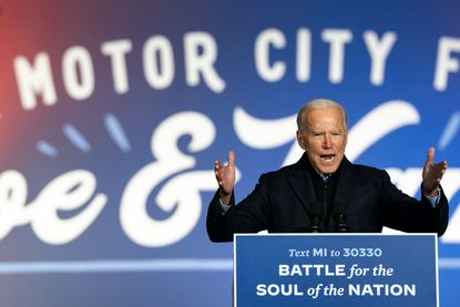 Joe Biden speaks during a drive-in campaign rally at Belle Isle on October 31, 2020 in Detroit, Michigan