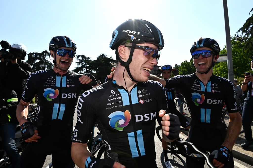 Team DSM celebrate with Alberto Dainese after his stage 11 win in the 2022 Giro d&#039;Italia