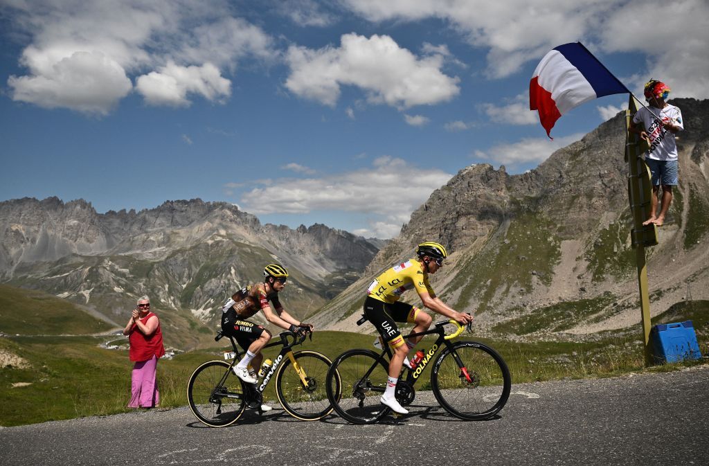 UAE Team Emirates teams Slovenian rider Tadej Pogacar wearing the overall leaders yellow jersey CR cycles in front of JumboVisma teams Danish rider Jonas Vingegaard CL in a breakaway during the 11th stage of the 109th edition of the Tour de France cycling race 1517 km between Albertville and Col du Granon Serre Chevalier in the French Alps on July 13 2022 Photo by Marco BERTORELLO AFP Photo by MARCO BERTORELLOAFP via Getty Images