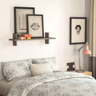 bedroom with bedroom shelf and artwork