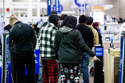Shoppers crowd into the entryway as Best Buy opens for Black Friday on November 26, 2021 in Westminster, Colorado. 