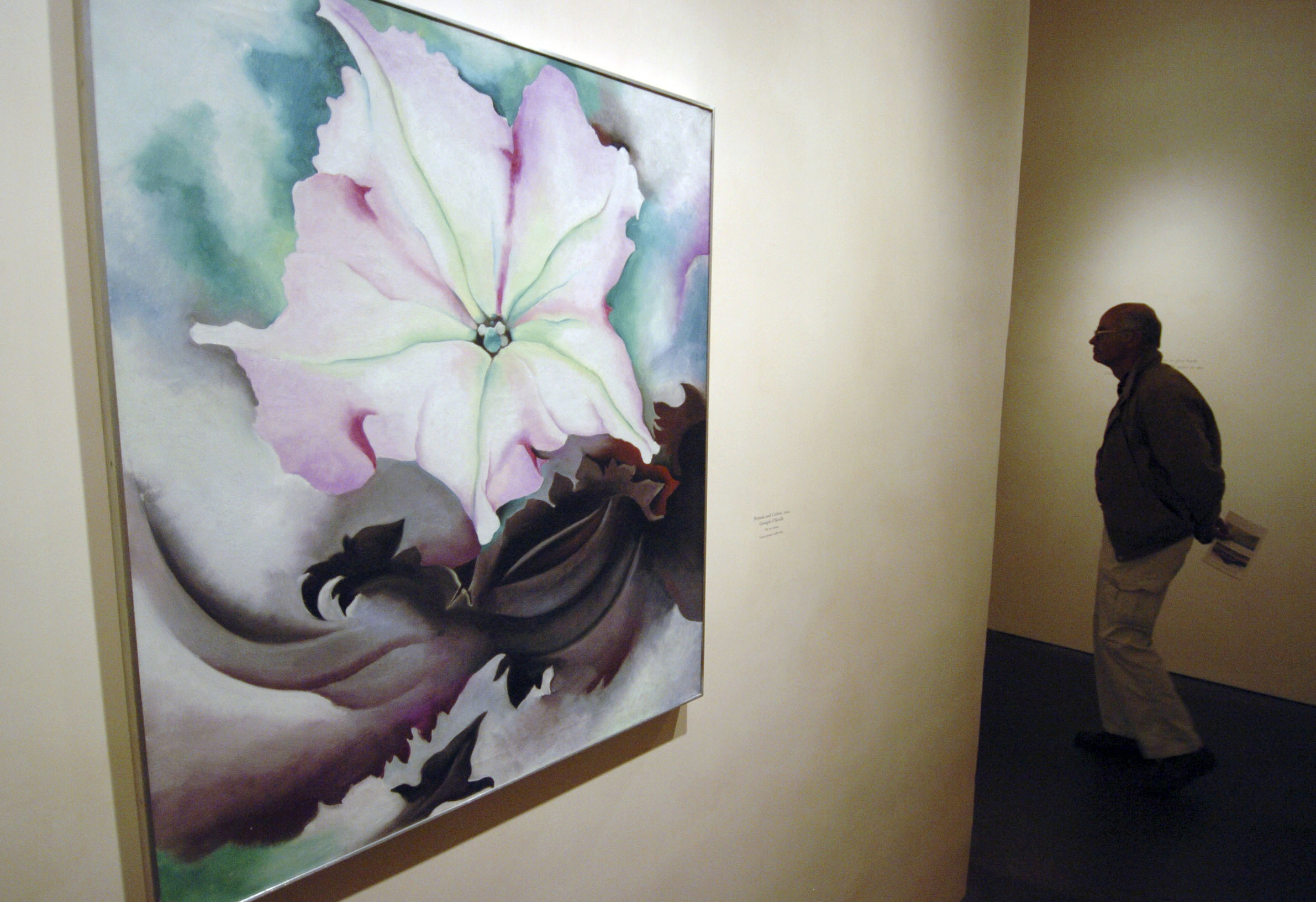 A painting of a lily hanging on a wall