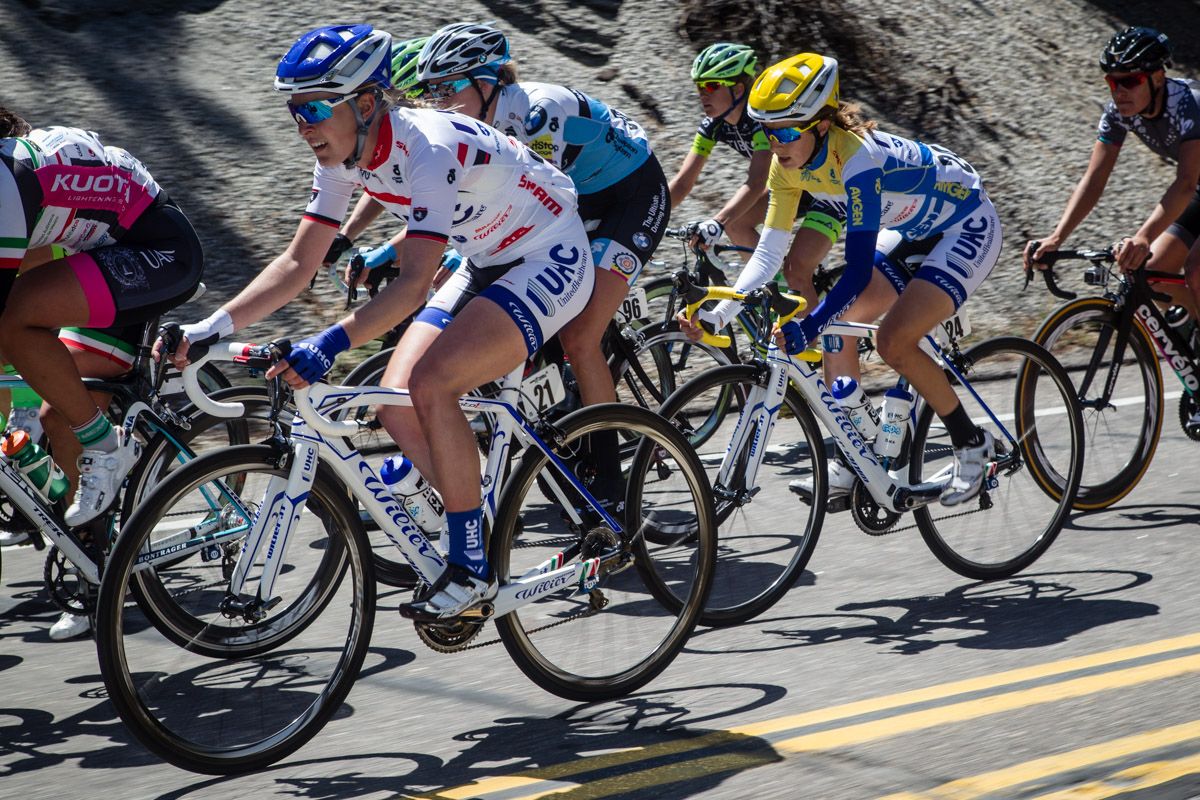 Hannah Barnes (UnitedHealthcare) rides to protect teammate Katie Hall.