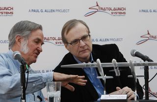 Microsoft co-founder Paul Allen, right, confers with airplane designer Burt Rutan during the 2011 unveiling of the Stratolaunch concept.