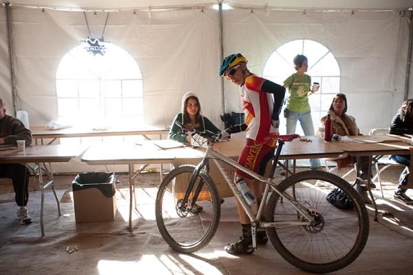 Karen Rishel with team NoTubes/Velo Bella checks in at the exchange tent for her third lap in the 24 Hours in the Old Pueblo race. Rishel took first place in the Solo - Singlespeed Female category.