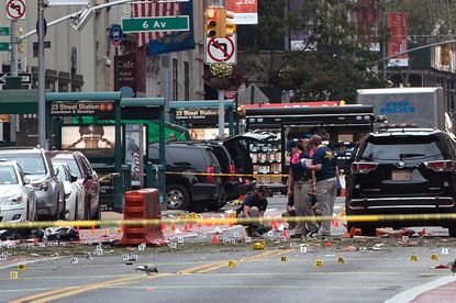 FBI agents examine the scene of Saturday night's bombing in New York City.