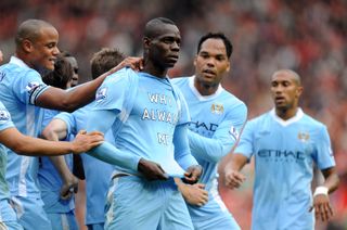 Mario Balotelli reveals a shirt with the message 'Why always me? on it after scoring for Manchester City against Manchester United in 2011.